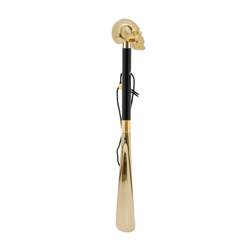 Schuhanzieher mit goldenem Totenkopf